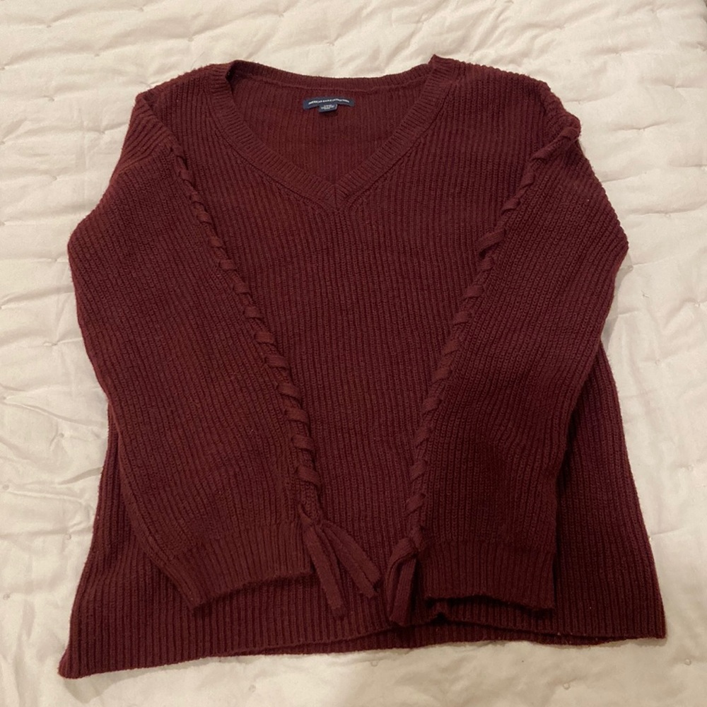 American Eagle burgundy sweater with side detail on the arms
